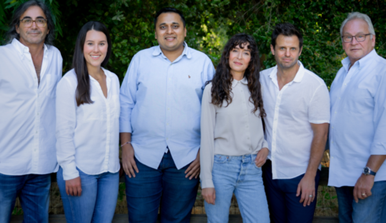 Whimstay team poses for group photo after recent crowdfunding success