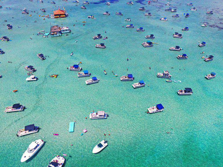 Boats gather in blue waters off the shore of Destin Florida