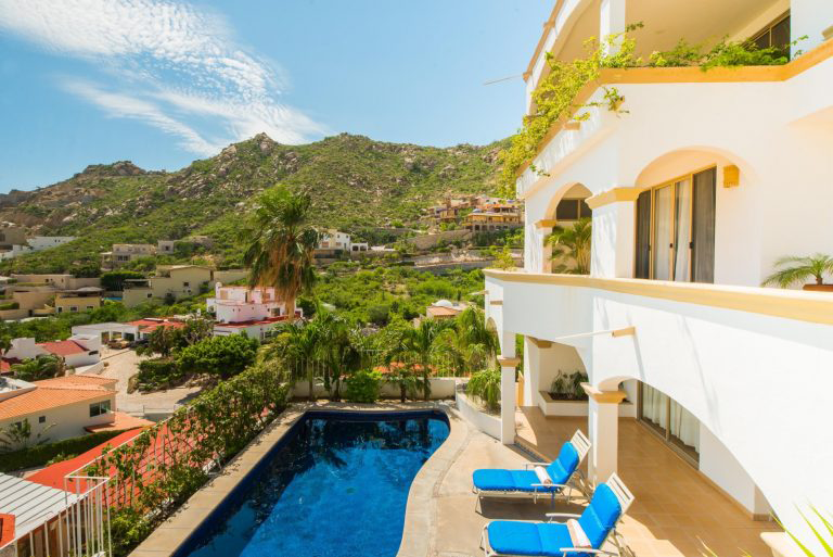 A lush lookout from the pool of Villa Victoria