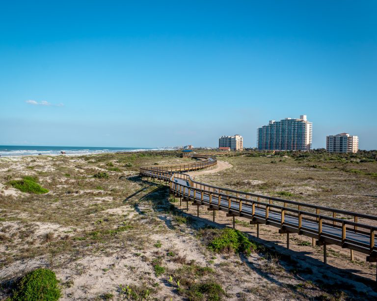 A picturesque path in New Smyrna Beach, a great destination for affordable beach rentals