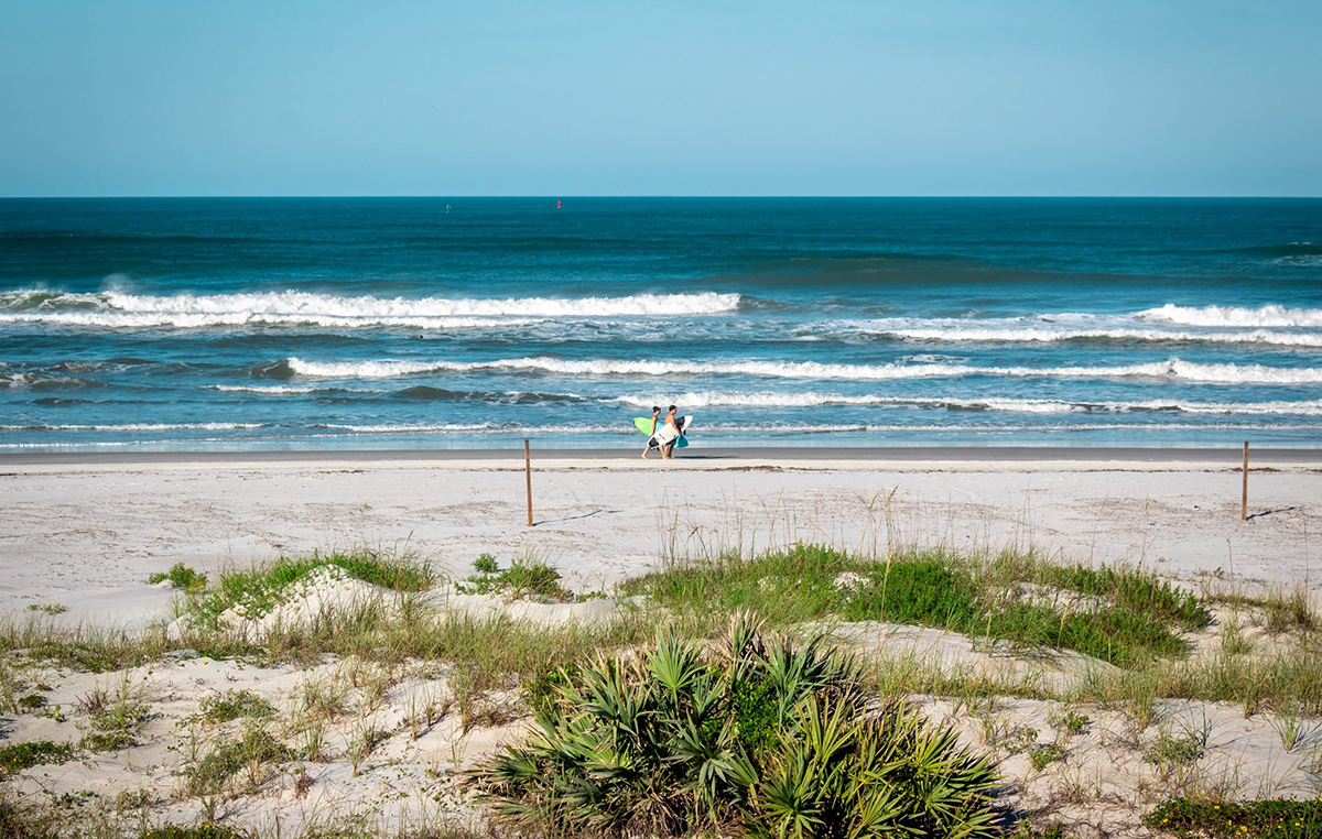 Two surfers at New Smyrna Beach