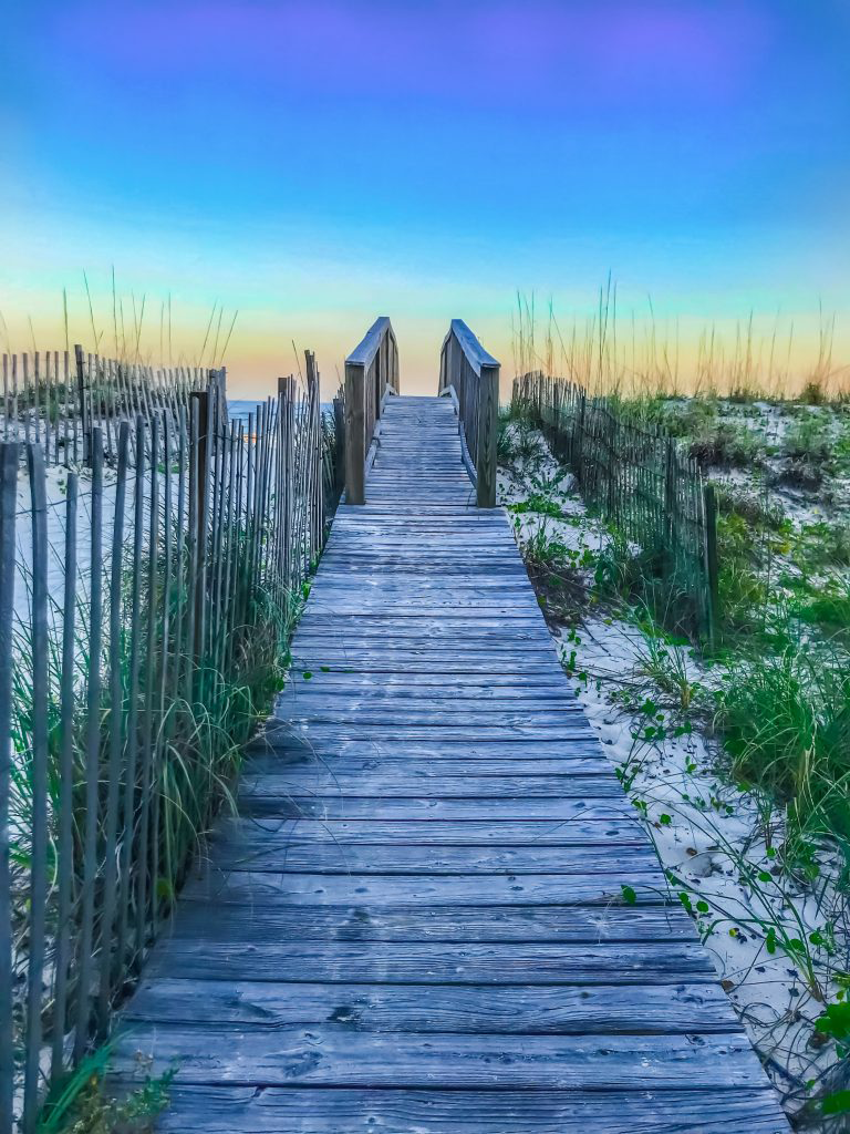 Take a sunset stroll along the boardwalk in Gulf Shores