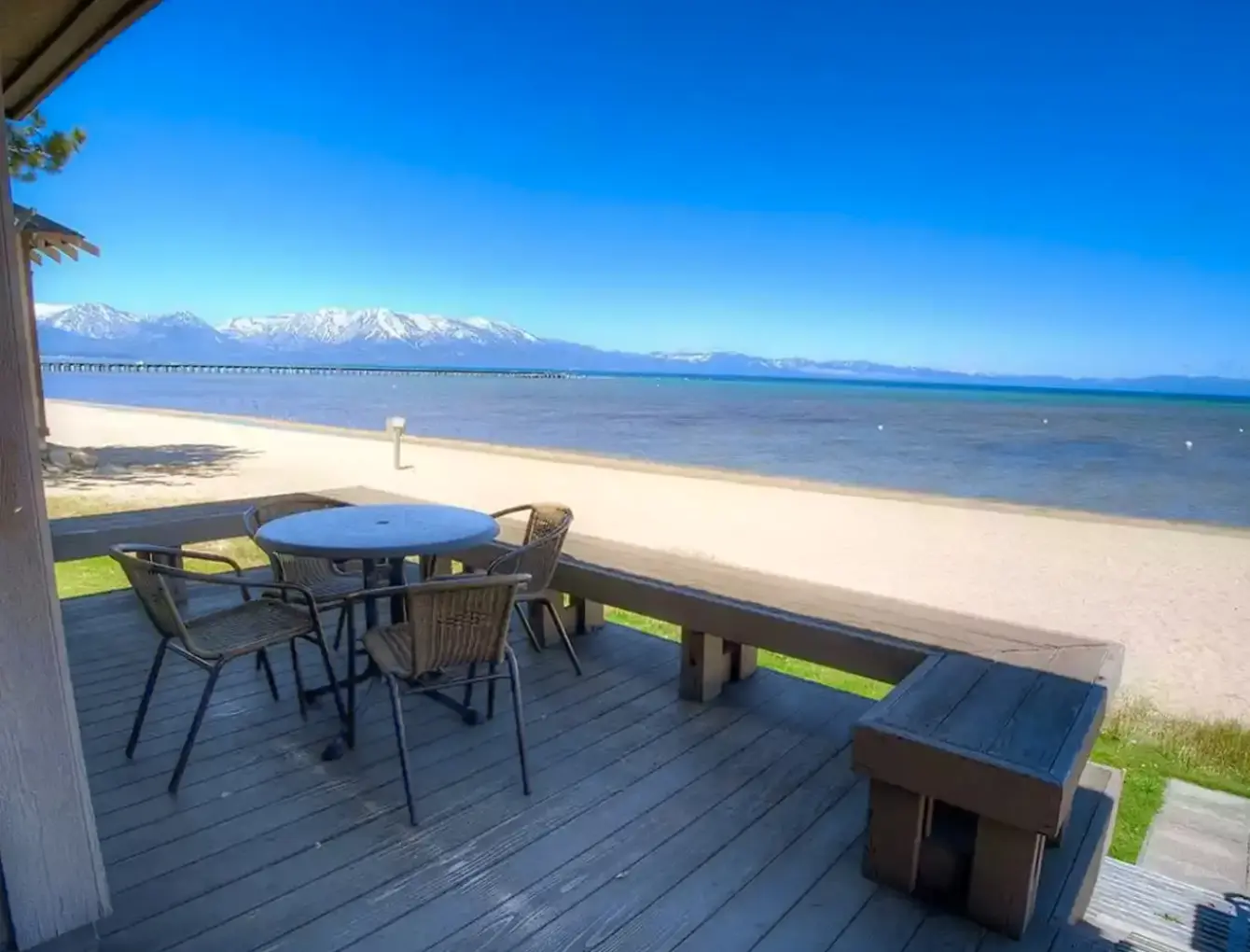 Vacation cabin rental in lake tahoe with deck directly positioned over beach