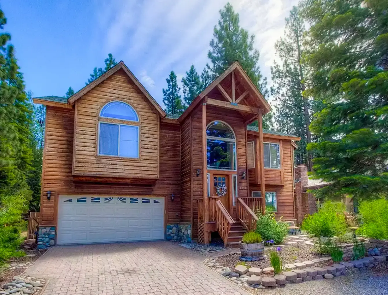 View of a log cabin in lake tahoe surrounded by trees