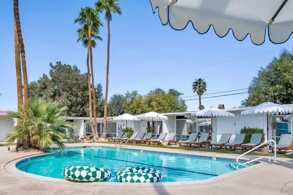 a last minute desert getaway in palm springs. this mid century modern vacation rental is featured with a pool and lots of lounge chairs