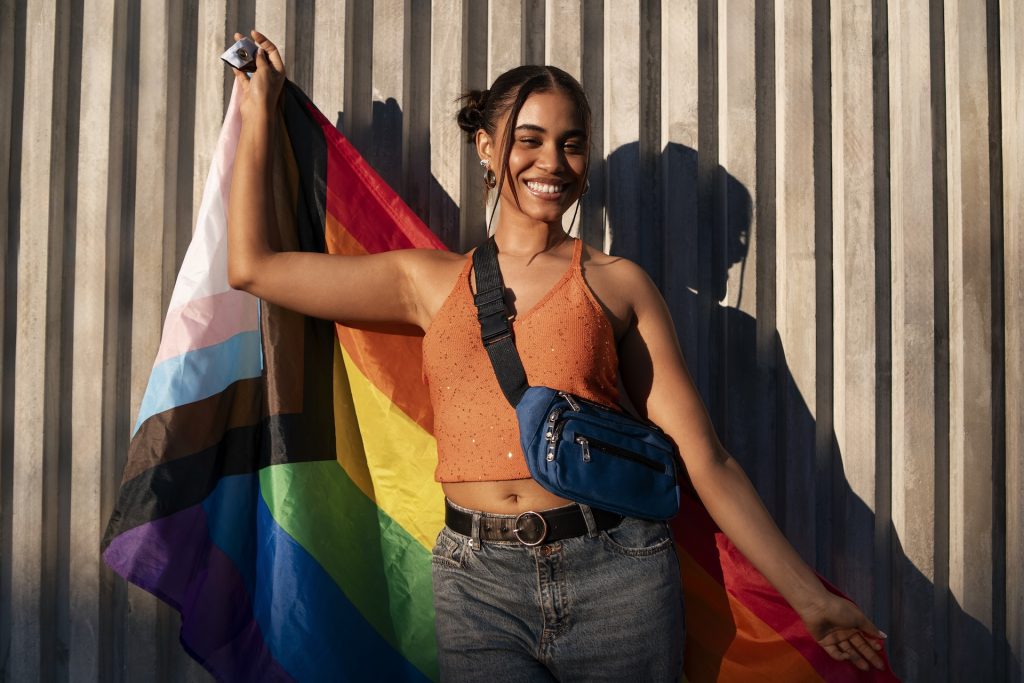 Woman holding a rainbow flag