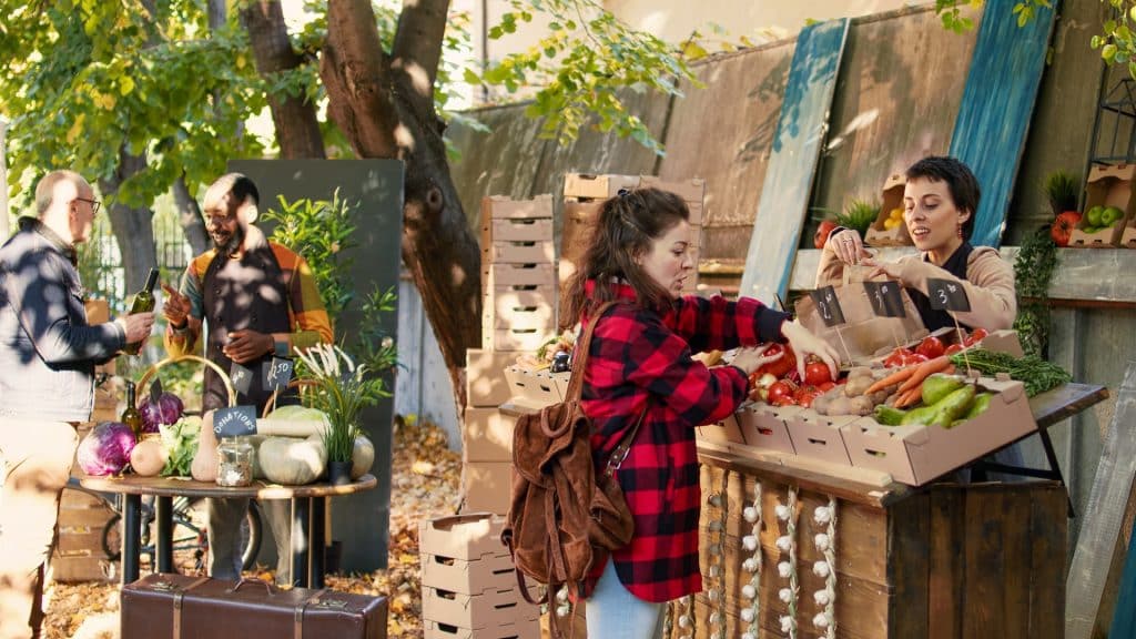 A woman shopping for vegetables at a food market