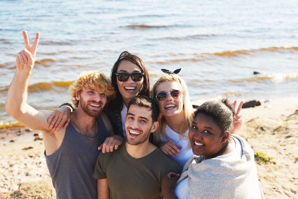 Five friends on the beach together