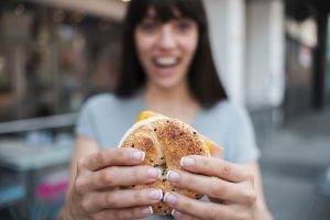 woman eating a bagel