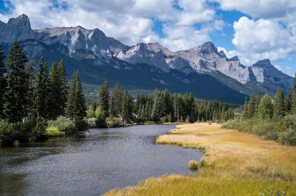 A river through the village surrounded by mountains