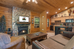 A living room with fireplace in a cabin.